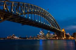 The harbour bridge in Sydney, Australia, with downtown and the Opera House in the background.